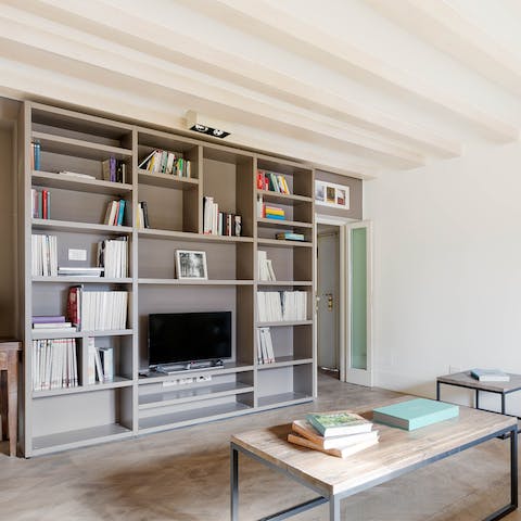 Select a book off the shelves and unwind on the sofa