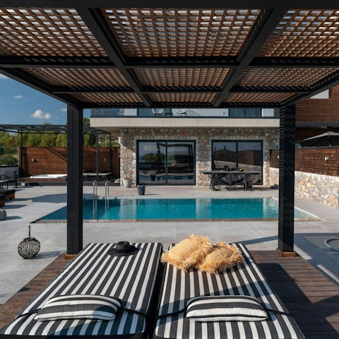 Doze in the shade beside the private pool