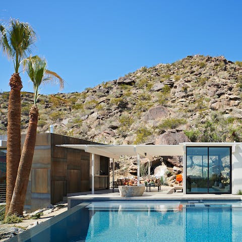 Swim in your crystal-clear infinity pool beneath desert skies