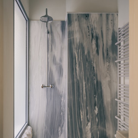 Wash off the city in your marble rain shower