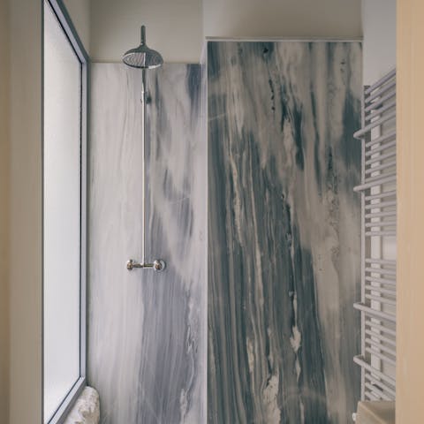Wash off the city in your marble rain shower