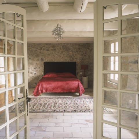 Retire in the cavernous bedroom