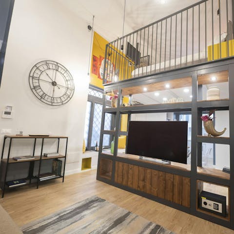 Return to this colourful loft after a busy day of sightseeing