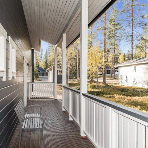 Sit out on the veranda in your own patch of woodland