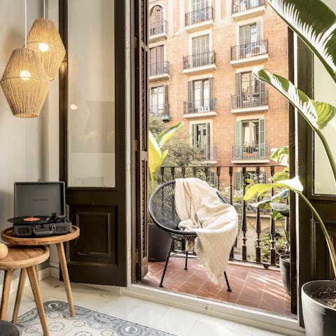 Soak up some sun on the living room's balcony