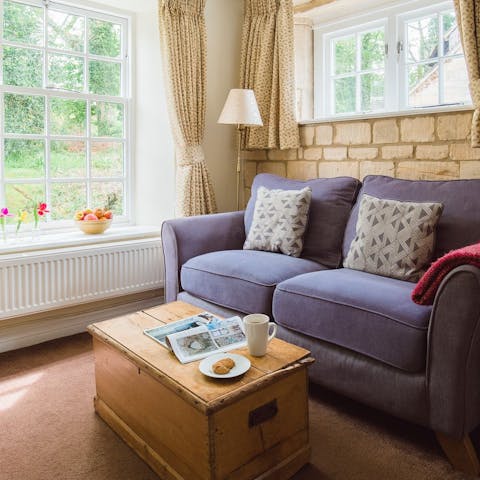 Curl up with a good book and soak up the woodland scenes outside