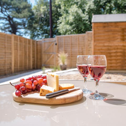 Sit out in the garden and enjoy dinner while watching a coastal sunset above you