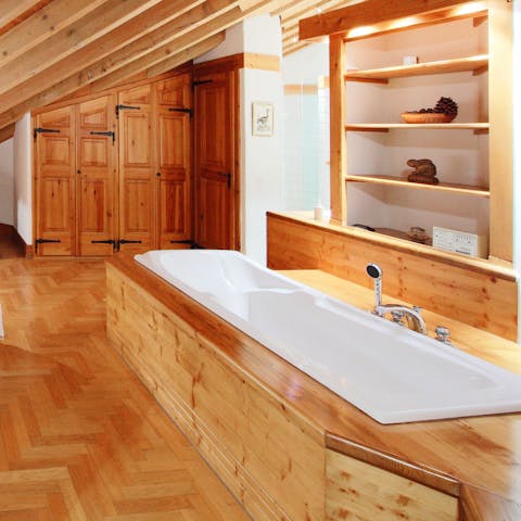 Soak tired muscles in the master suite's giant tub