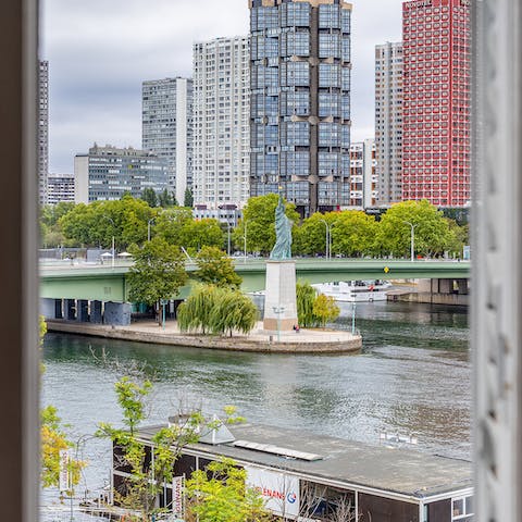 Spot Paris' own statue of liberty on the Seine from your window