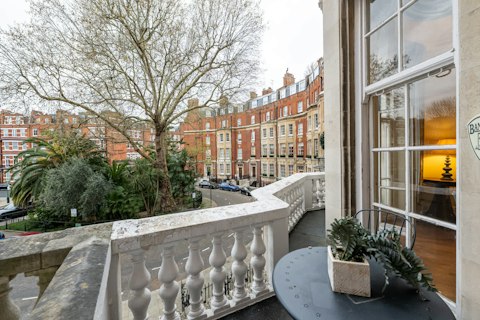 Drink your morning brew on the balcony overlooking leafy Knightsbridge streets