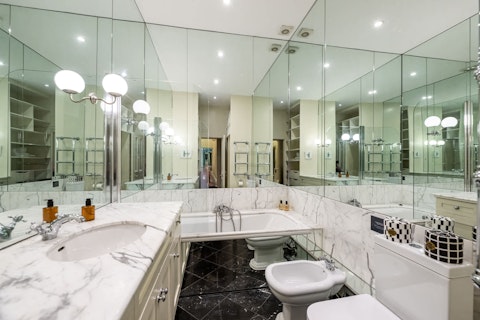 Luxuriate in a generous bathtub after a day exploring Knightsbridge