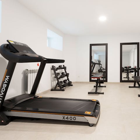 Stay on top of your fitness goals with a workout at the communal gym