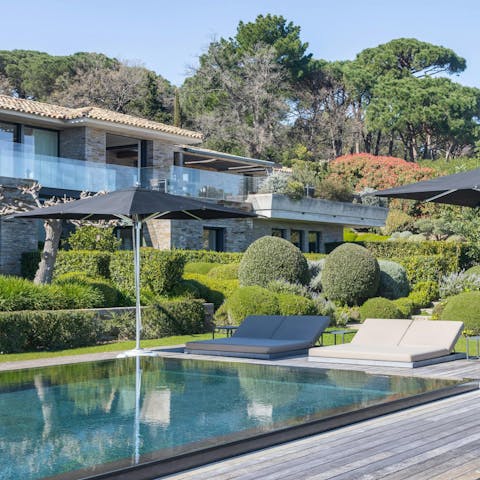 Chill out by the private pool and enjoy the lush scenery
