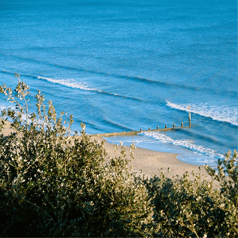 Enjoy a morning stroll along Bournemouth Beach, only a ten-minute drive away