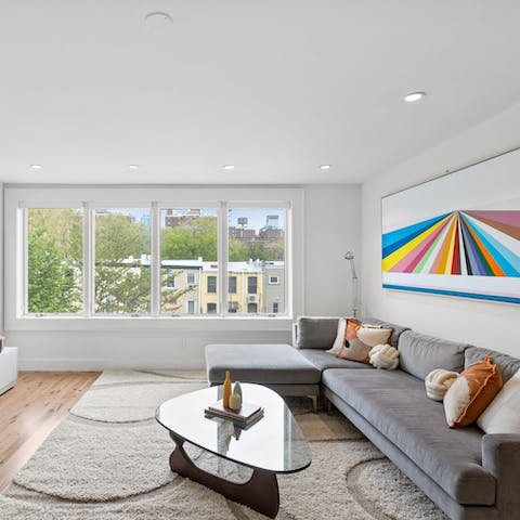 Relax in the stylish living area after a busy day in the city