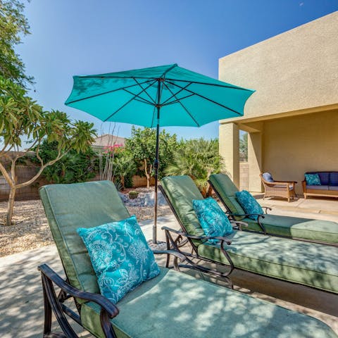 Enjoy the flow of indoor-outdoor living here and put your feet up on these sun loungers
