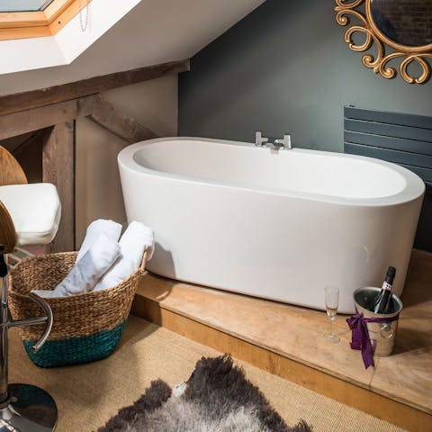 Soak your troubles away in the sleek bathtub