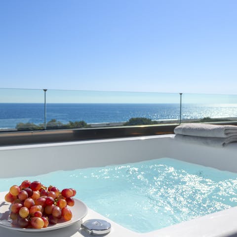 Sink into the private hot tub