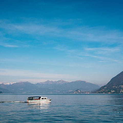 Hop aboard a ferry to journey across Lake Como