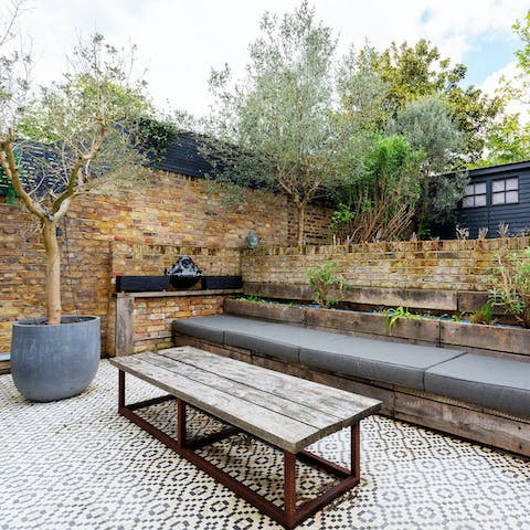 Tuck into dinners in the terraced and tiled garden