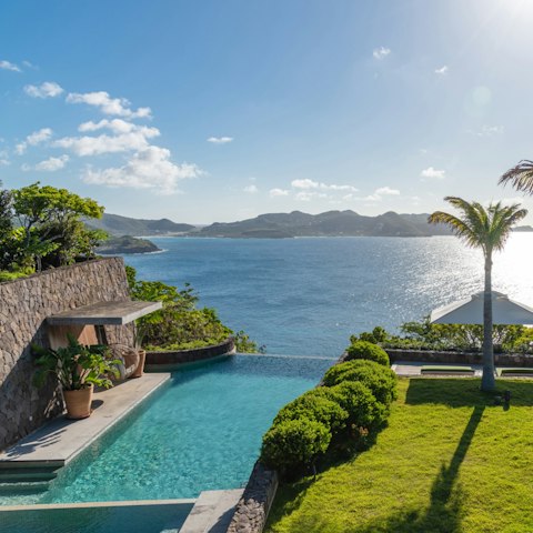 Float above the Caribbean as the water meets the horizon
