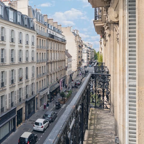 Perch on the Juliet balcony with a morning coffee and a front-row seat to Paris life