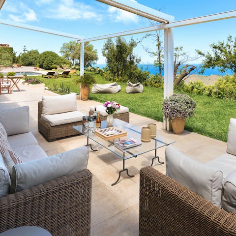 Have a glass of Sicilian wine on the terrace at sunset