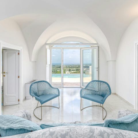Chill in the minimalist living space, framed by the view