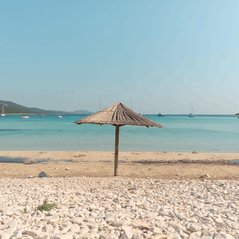 Drive to Cala del Gesso for a splash about in the sea