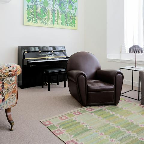 Play a few tunes on the living room piano