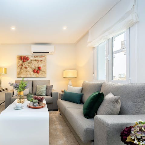 Chill out in stylish living area, a glass of Spanish wine in hand