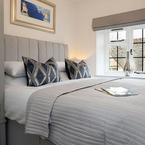 Sink into the sumptuous bed after a day exploring the Cotswolds