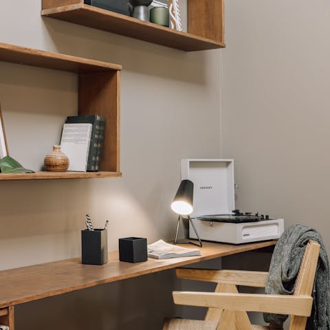 Set up your laptop at the handy desk and catch up on some work