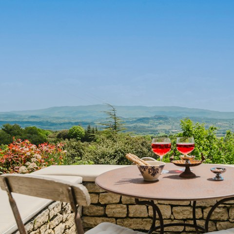 Watch the sunset as you sip a glass of French wine