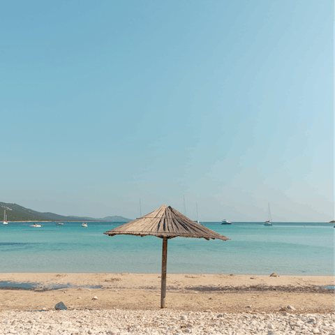 Walk along the sands at Playa de Canadell, 400 metres from this home