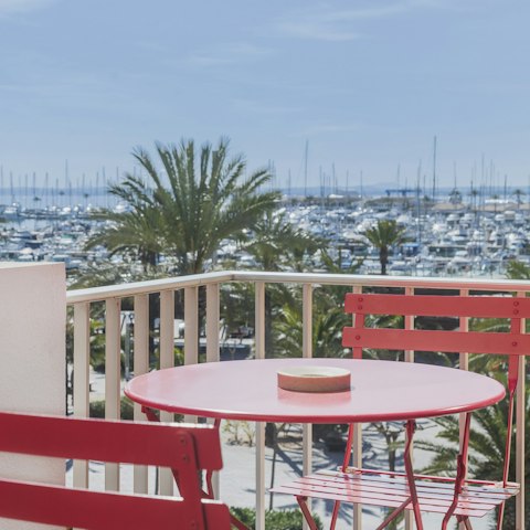 Enjoy alfresco tapas meals on the balcony with marine views