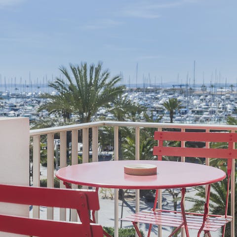 Enjoy alfresco tapas meals on the balcony with marine views