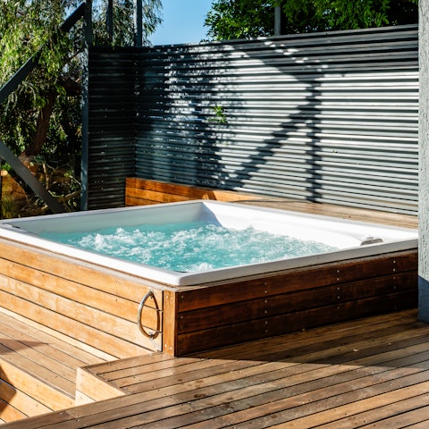 Take up residence in the hot tub just as the sun begins to set