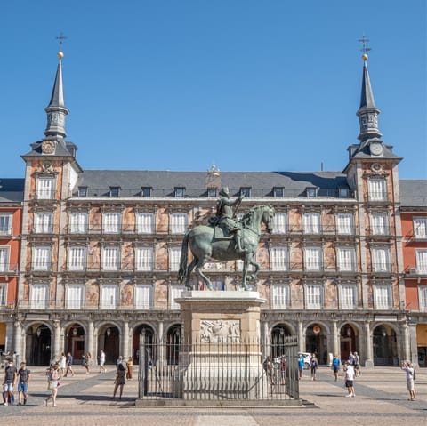 Hop on a bus down to the bustling Plaza Mayor