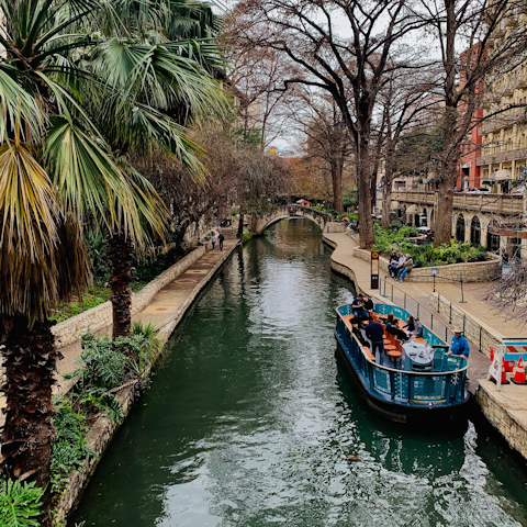 Take a stroll along the San Antonio River Walk, twelve minutes in the car