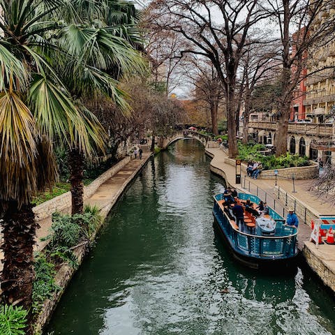 Take a stroll along the San Antonio River Walk, twelve minutes in the car