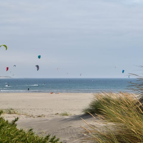 Bring your board and surf the waves at Praia do Moledo, a short drive away