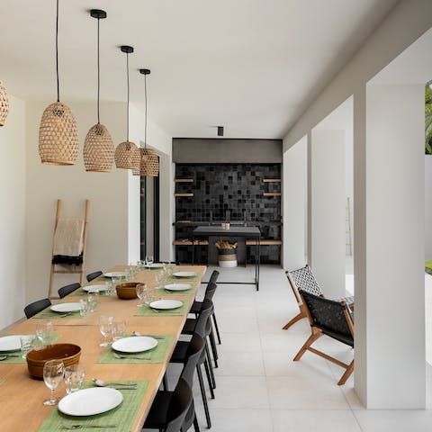 Work culinary magic in the outdoor kitchen and serve up to hungry guests seated on the covered terrace