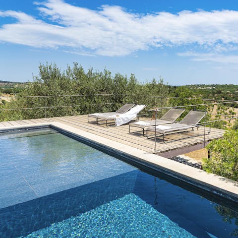 Spend your days lounging by the private swimming pool