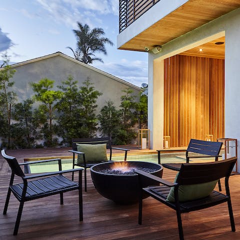 Gather around the fire pit as the sun goes down