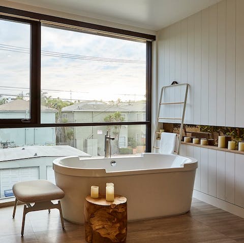 Light some candles and sink into the deep bathtub