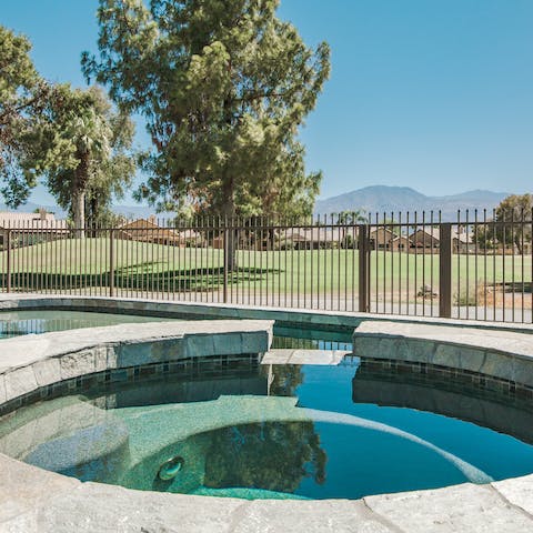 Gaze out over mountain views from the hot tub