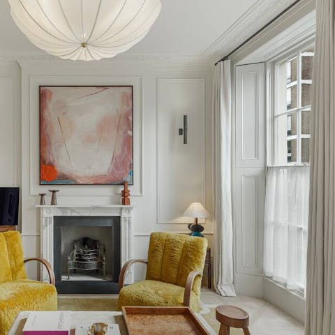 Admire the original features inside like marble fireplaces and corniced ceilings