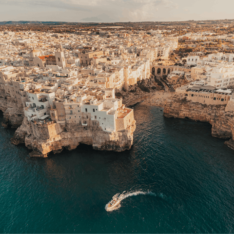 Visit clifftop coastal towns such as Polignano a Mare