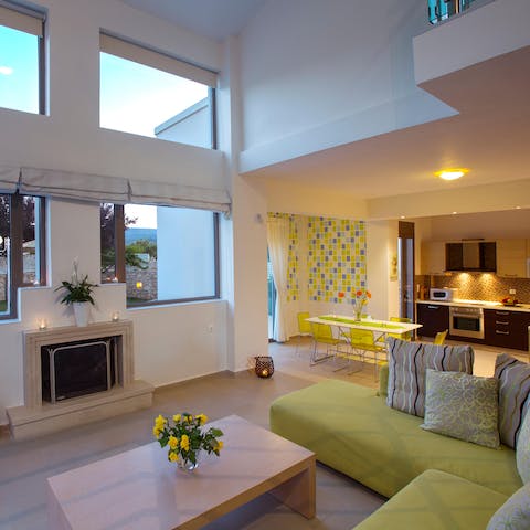 Kick back and relax in the bright living room with a glass of wine after a day of fun in the sun